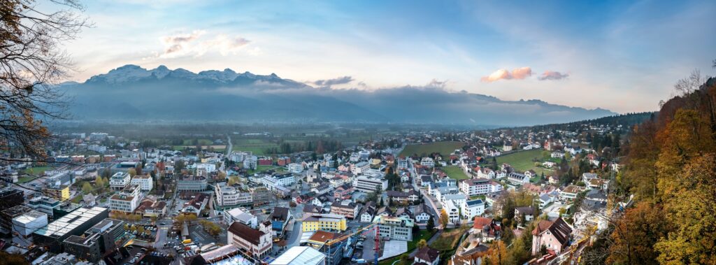 Panoramic Aerial view of Vaduz at sunset with Appenzell Alps on background - Vaduz, Liechtenstein